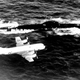 A P-3 Orion from Patrol Squadron 10 (VP-10) flies over a Soviet Victor III class submarine. (US Navy)